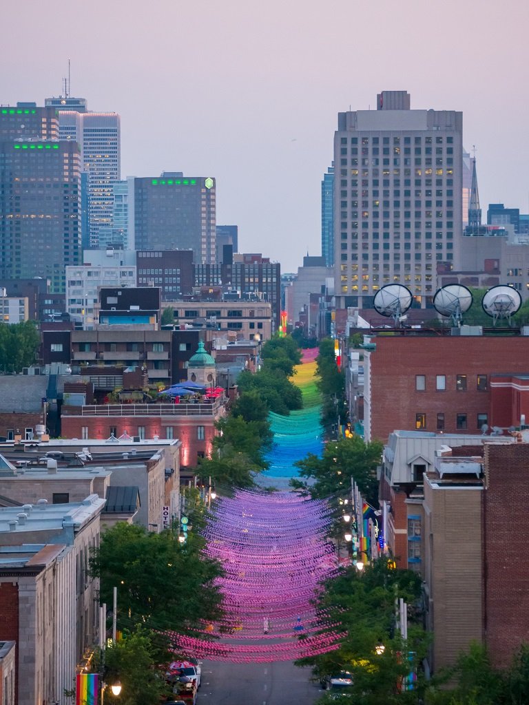 where to stay Montreal village neighbourhood - Pack and Jet travel blog - Rainbow balls installation on Saint-Catherine Street in gay Village, Montreal, Canada